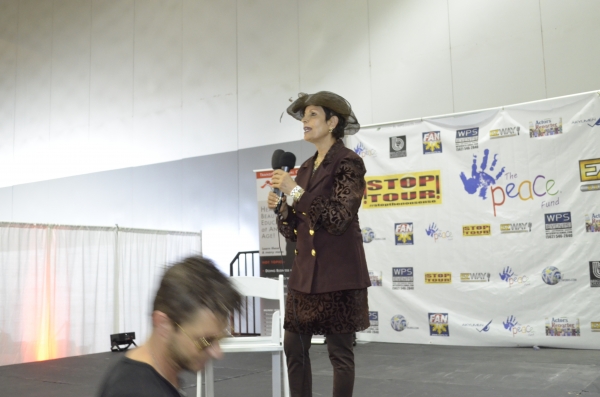 Dame Munni Irone speaks on stage at Ascent Expo